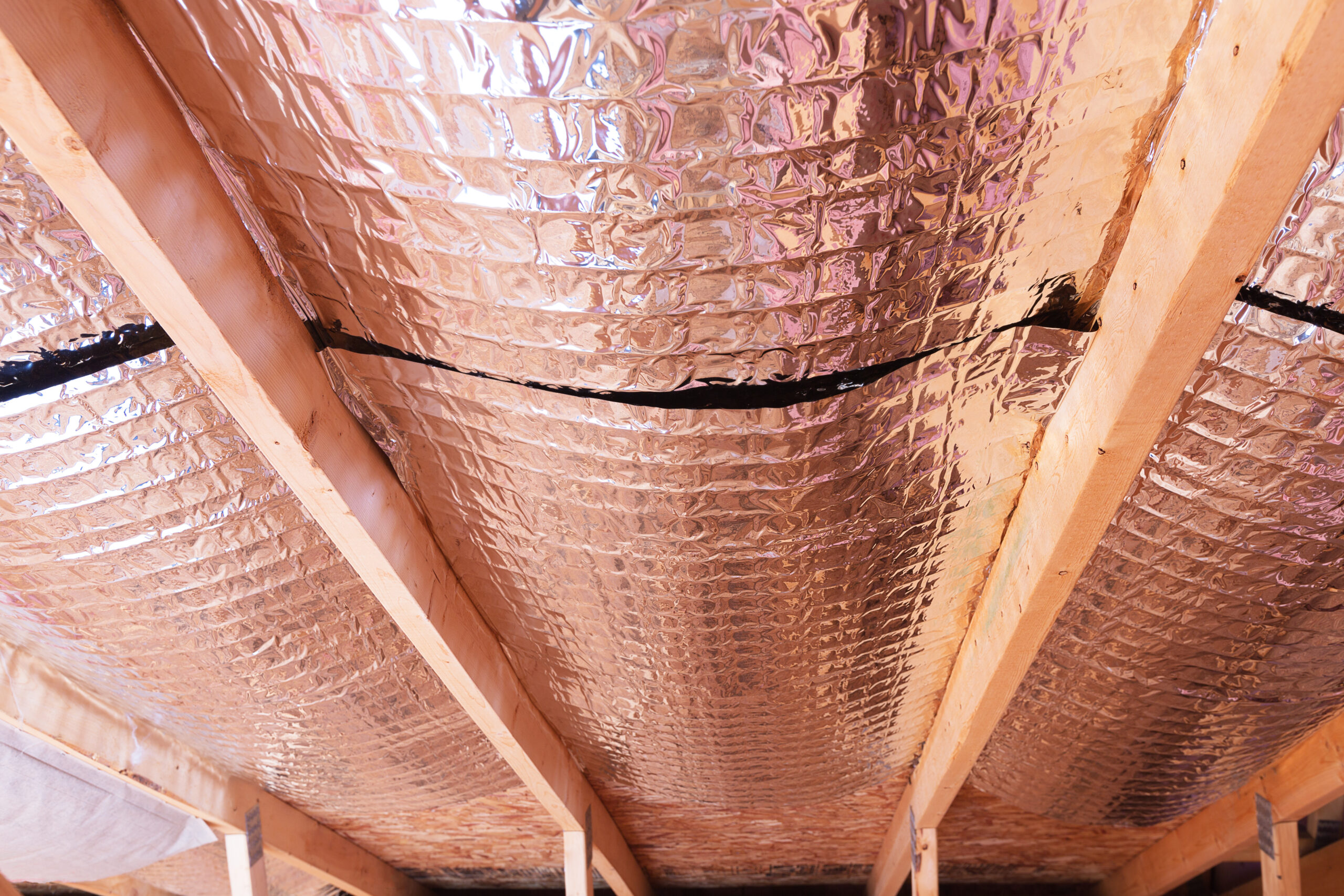Insulating,Of,Attic,With,Fiberglass,Cold,Barrier,And,Reflective,Heat